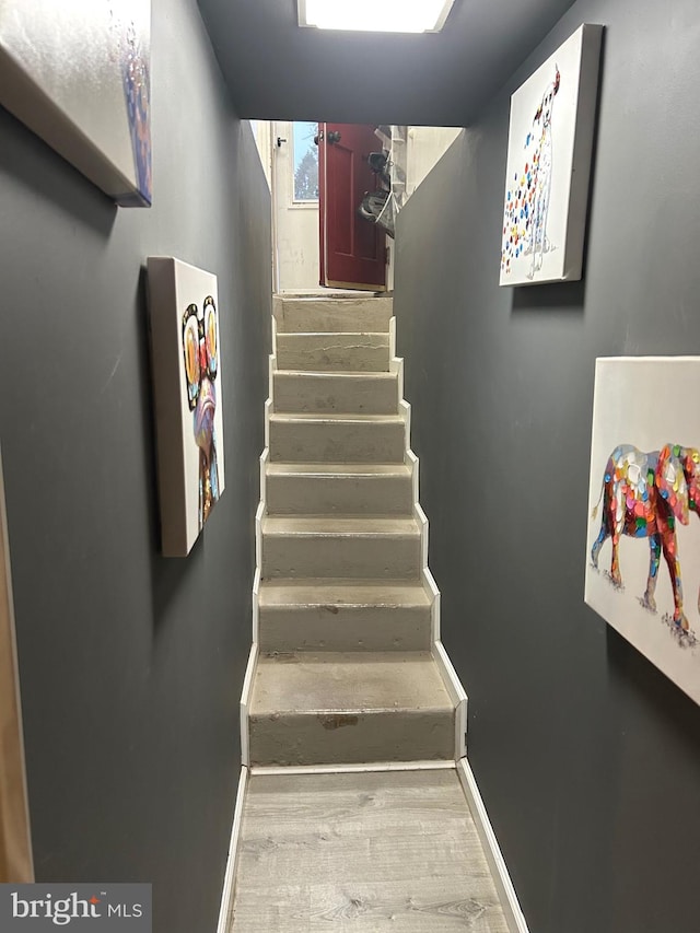 stairs with wood-type flooring