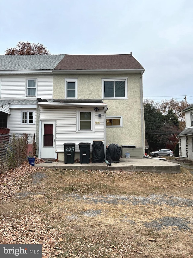 rear view of property featuring a patio area