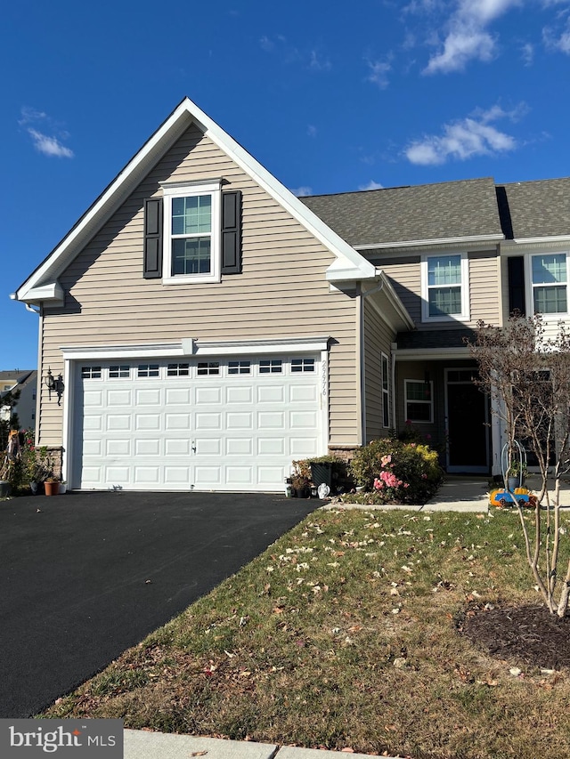 front facade with a garage