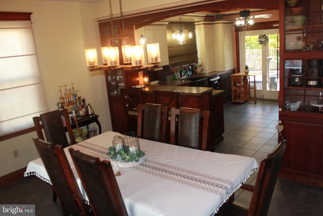 dining room with dark tile patterned flooring and sink