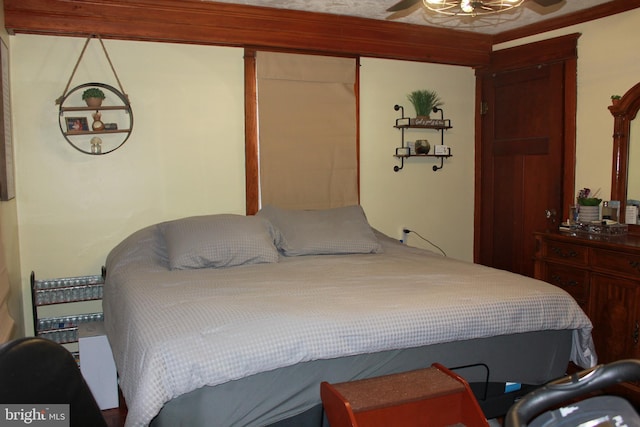 bedroom with ceiling fan and a closet