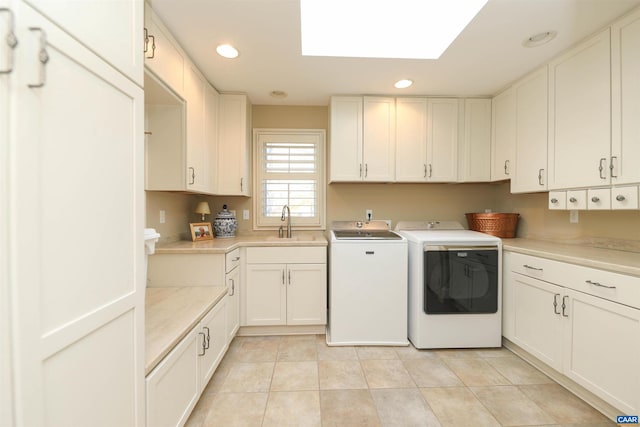 1790 Shelbourn Ln, Keswick, VA 22947 - laundry area with separate washer and dryer, cabinet space, recessed lighting, light tile patterned floors, and a skylight