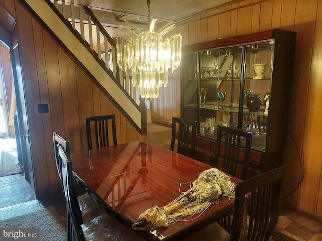 dining area featuring wooden walls