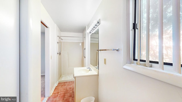 33945 Middleton Cir Unit 1, Lewes, DE 19958 - bathroom featuring vanity, a walk in shower, and tile patterned floors