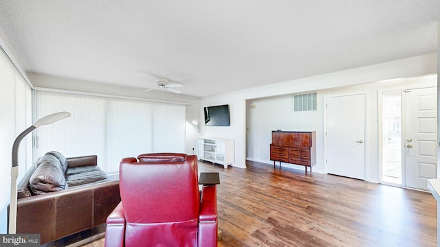33945 Middleton Cir Unit 1, Lewes, DE 19958 - living room featuring wood finished floors, ceiling fan, and baseboards