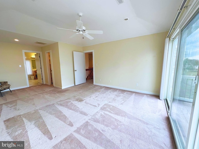 unfurnished room featuring light carpet and ceiling fan