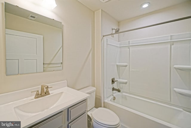 full bathroom with toilet, vanity, and washtub / shower combination