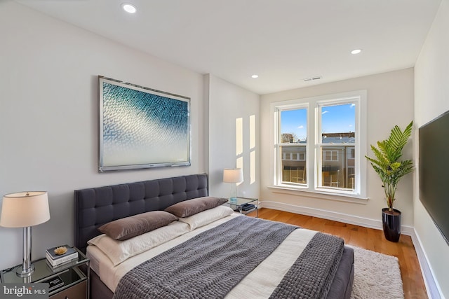 bedroom with light hardwood / wood-style flooring