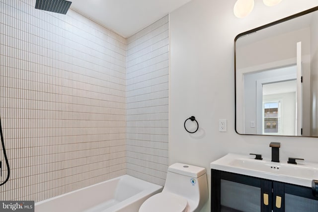 full bathroom featuring vanity, toilet, and tiled shower / bath combo