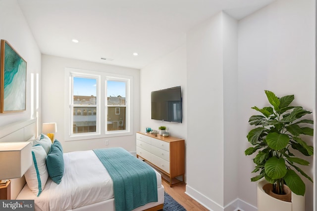 bedroom featuring light hardwood / wood-style flooring