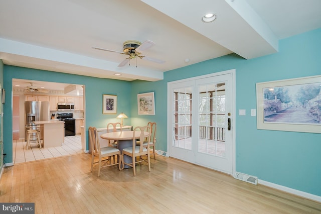 dining area featuring ceiling fan and light hardwood / wood-style flooring