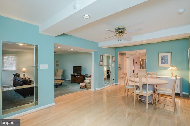 dining area featuring hardwood / wood-style floors and ceiling fan