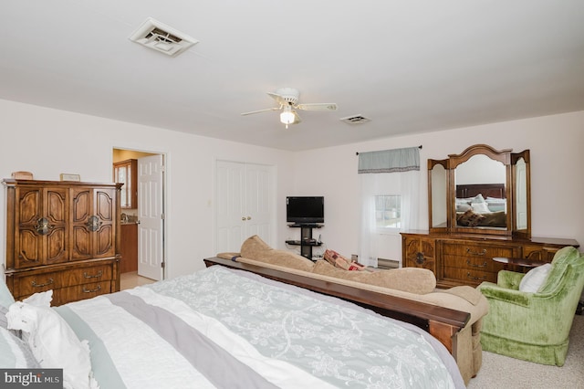 bedroom featuring ceiling fan, light colored carpet, and a baseboard radiator