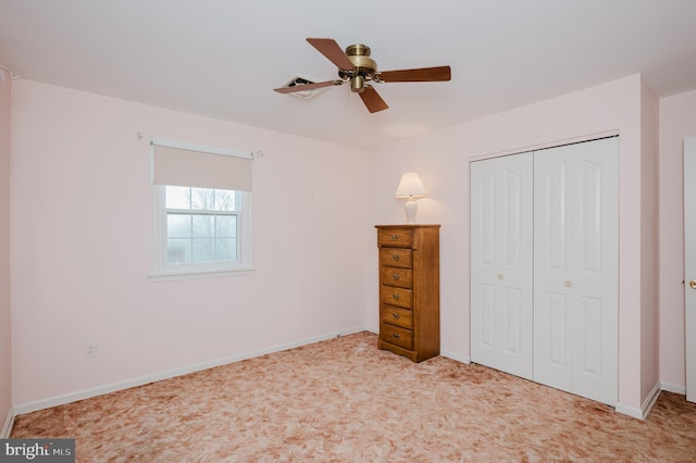 unfurnished bedroom with a closet and ceiling fan