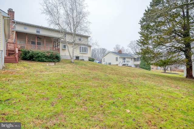 view of yard with ceiling fan