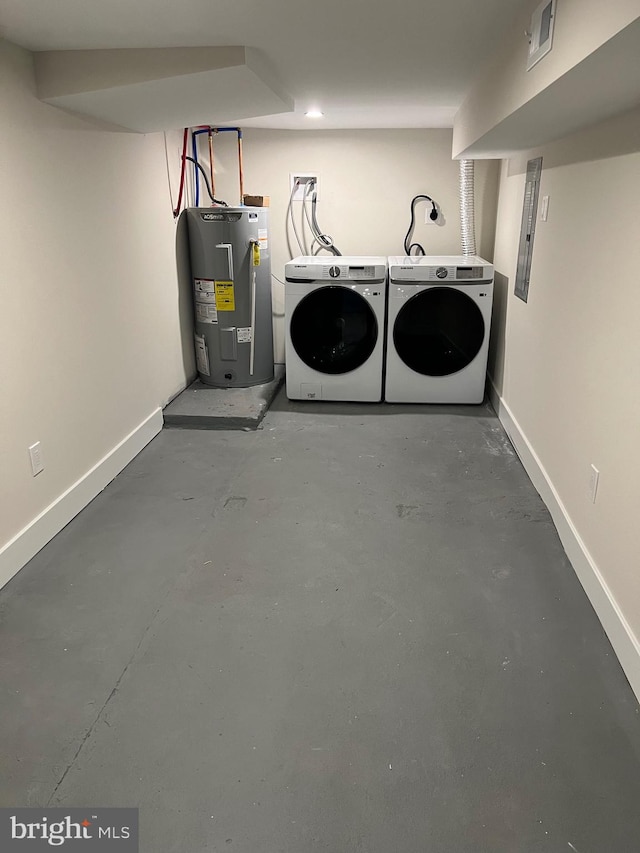 washroom featuring washing machine and clothes dryer and water heater