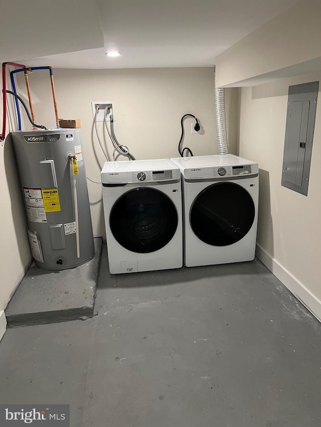 washroom with independent washer and dryer, electric panel, and water heater