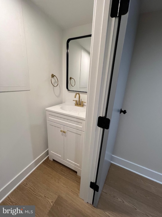 bathroom featuring hardwood / wood-style floors and vanity