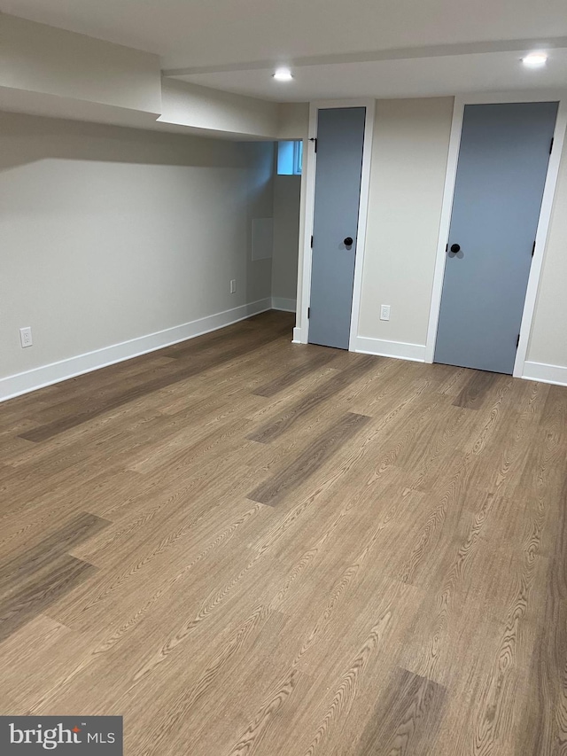 basement featuring light hardwood / wood-style flooring