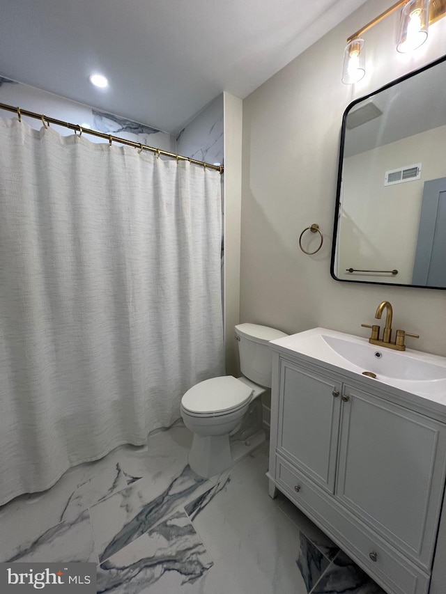 bathroom with vanity and toilet