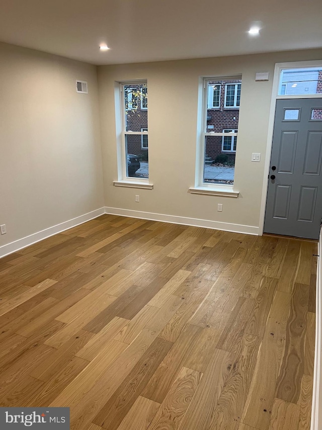 foyer with light hardwood / wood-style flooring