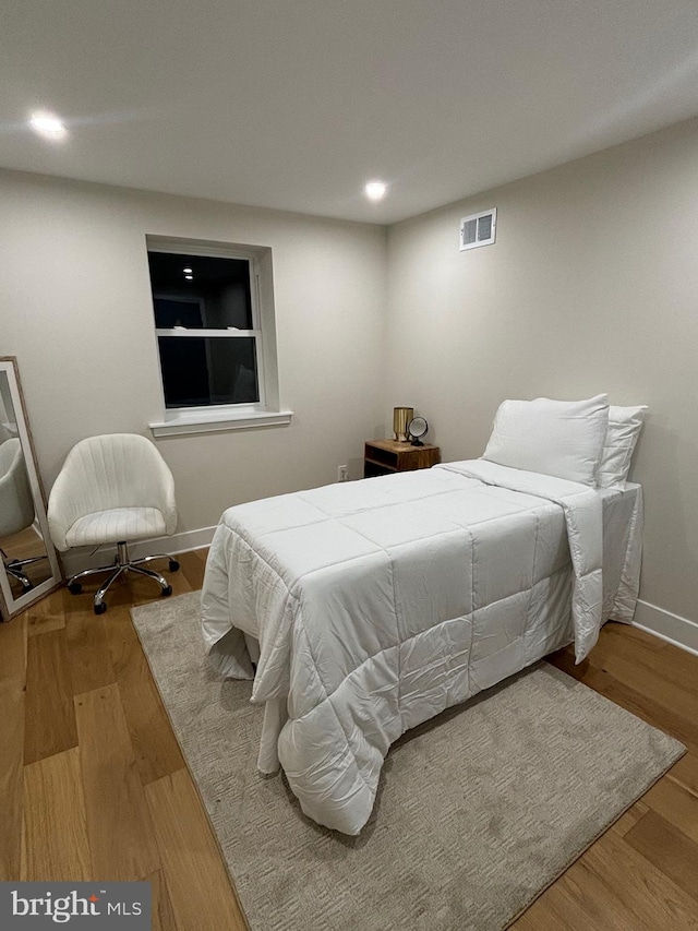 bedroom featuring hardwood / wood-style floors