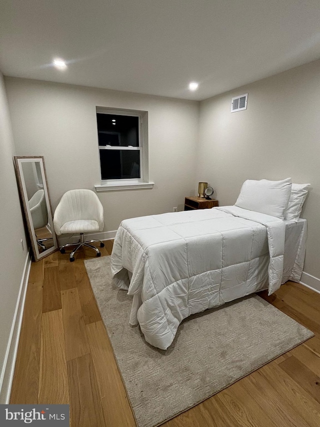 bedroom featuring light hardwood / wood-style flooring