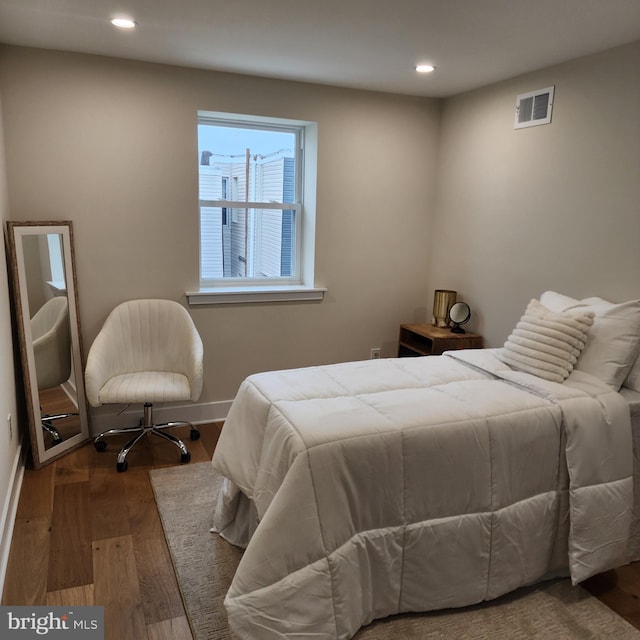 bedroom featuring hardwood / wood-style flooring