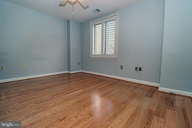 spare room with light hardwood / wood-style flooring and ceiling fan