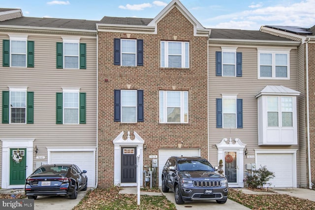 7638 Timbercross Ln, Glen Burnie, MD 21060 - view of property featuring an attached garage, driveway, and brick siding