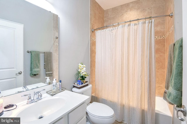 full bathroom featuring vanity, toilet, and shower / bathtub combination with curtain