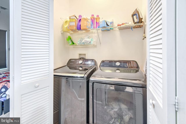 washroom with separate washer and dryer