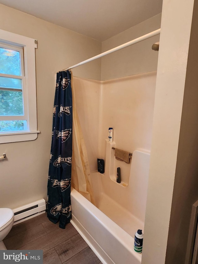 bathroom featuring hardwood / wood-style flooring, shower / bath combination with curtain, toilet, and a baseboard heating unit