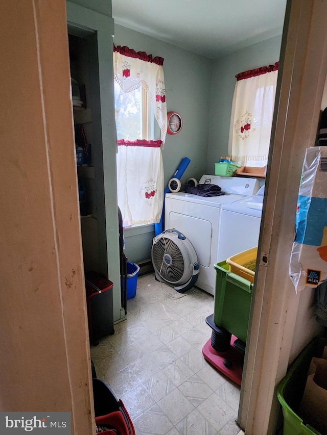 clothes washing area with independent washer and dryer