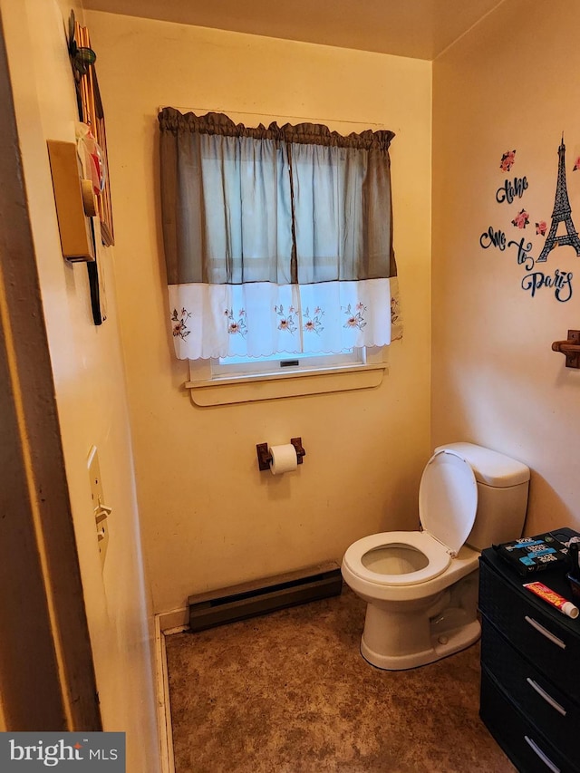 bathroom with a baseboard radiator and toilet