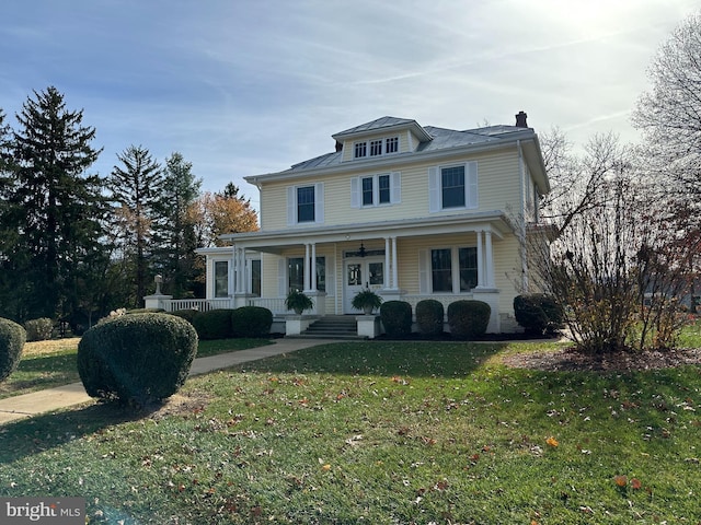 view of property with a porch and a front yard