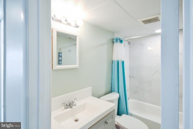 full bathroom featuring vanity, shower / tub combo, and toilet