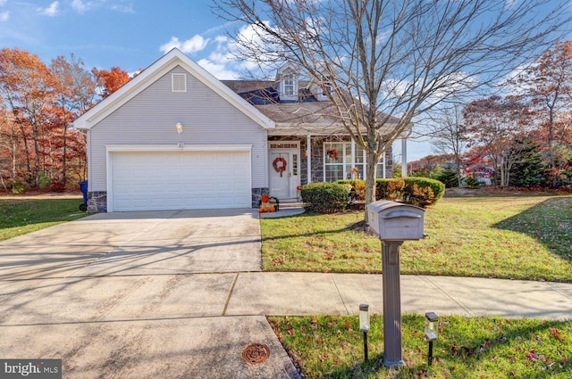 view of front of property with a front lawn and a garage