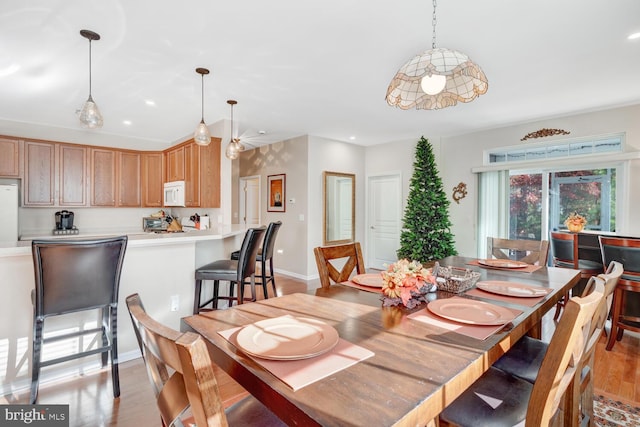 dining room with light wood-type flooring