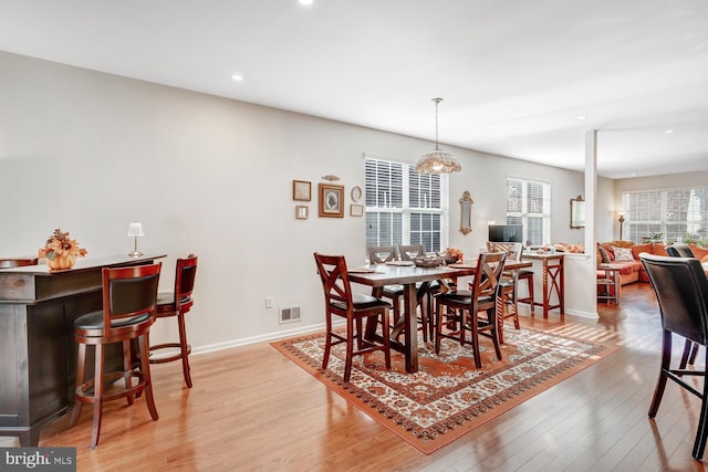 dining area with light hardwood / wood-style flooring