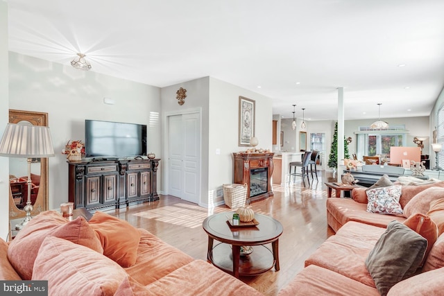 living room with light hardwood / wood-style flooring