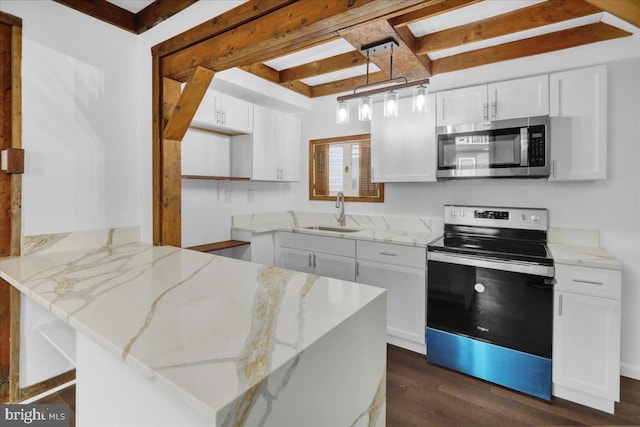 kitchen featuring white cabinets, stainless steel appliances, and sink