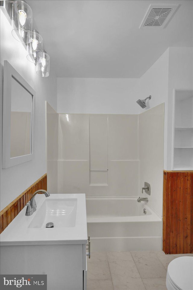 full bathroom featuring vanity, toilet, and shower / bathtub combination