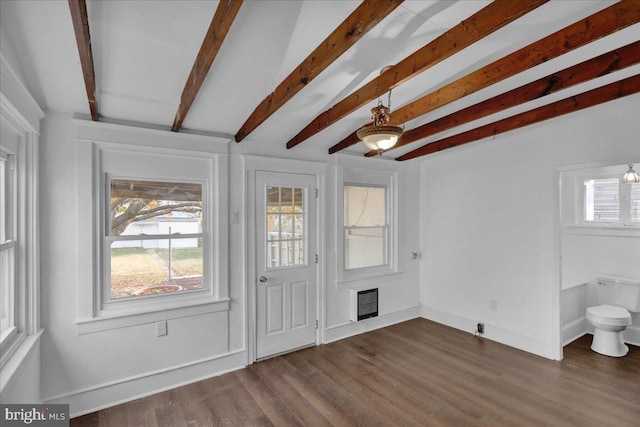 entrance foyer with vaulted ceiling with beams, heating unit, and dark wood-type flooring