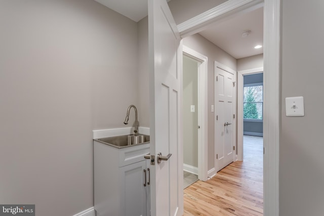 interior space featuring light hardwood / wood-style flooring and sink