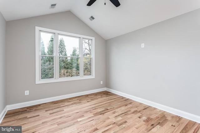 unfurnished room with ceiling fan, light hardwood / wood-style flooring, and vaulted ceiling