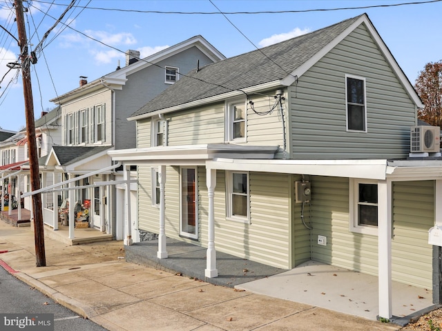 view of front of house featuring ac unit