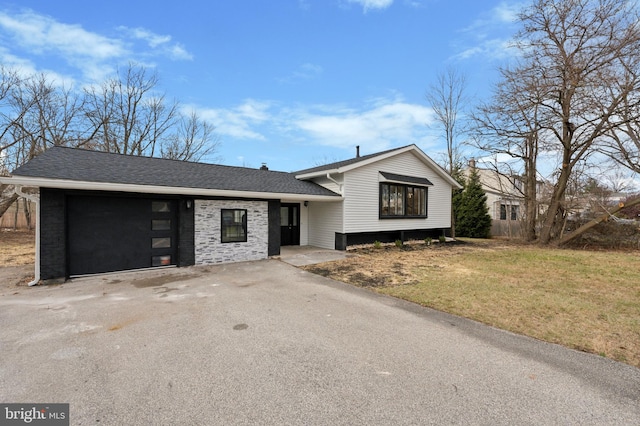 split level home with a front yard