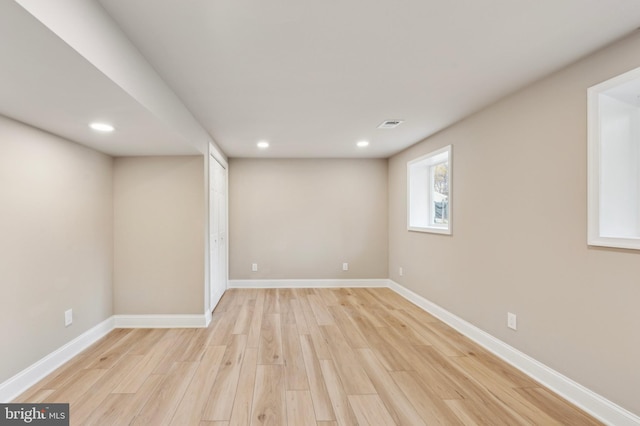 basement featuring light wood-type flooring