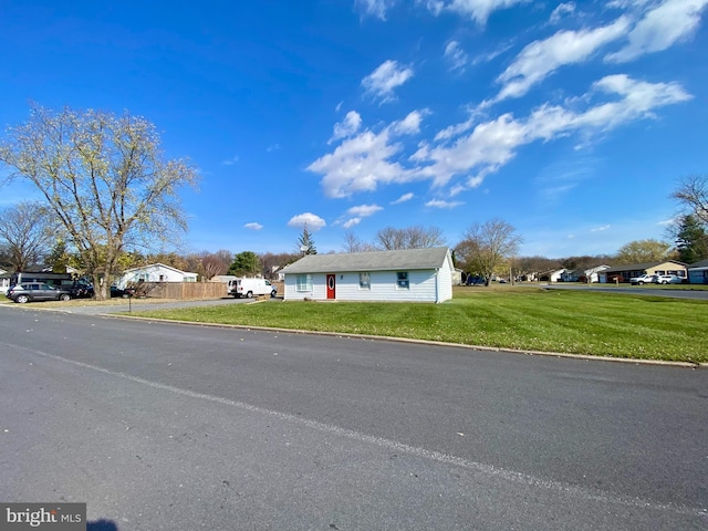 single story home with a front yard